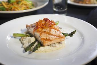 Product: On a bed of mushroom risotto with grilled asparagus
and sun-dried tomato ragout. - Midtown Cafe in Nashville, TN American Restaurants Product: On a bed of mushroom risotto with grilled asparagus
and sun-dried tomato ragout. - Midtown Cafe in Nashville, TN American Restaurants