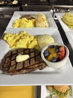 Product: 10oz Grilled angus eye of ribeye w/ truffle butter and two eggs any way. - Midtown Cafe in Nashville, TN American Restaurants Product: 10oz Grilled angus eye of ribeye w/ truffle butter and two eggs any way. - Midtown Cafe in Nashville, TN American Restaurants