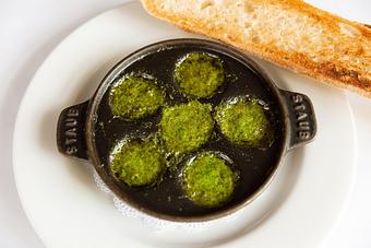 Product: Snails baked in garlic-herb butter in individual shells - Mon Ami Gabi in Bethesda, MD French Restaurants