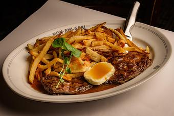 Product: Grilled steak frites with blue cheese sauce and hand-cut fries - Mon Ami Gabi in Bethesda, MD French Restaurants