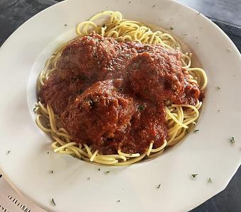 Product: Choose Meatballs or Italian sausage. Topped with our homemade meat sauce. Served with garlic bread. 15.95 - Nikolas Pizza in Newport, RI Pizza Restaurant