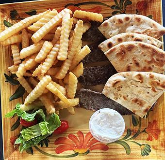 Product: The traditional spiced meat sliced and grilled. Served with warm pita bread, a side of Greek salad, French fries & tzatziki sauce. 16.95 - Nikolas Pizza in Newport, RI Pizza Restaurant