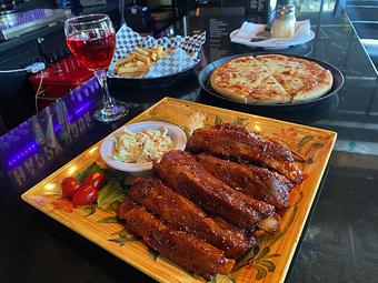 Product: Full Rack served with cornbread and choice of two sides: French fries- Coleslaw- Side House Salad- Baked Beans 23.95 - Nikolas Pizza in Newport, RI Pizza Restaurant