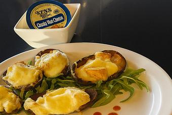 Product: Potato skins topped with buffalo chicken, mozzarella and bleu cheese. - Nikolas Pizza in Newport, RI Pizza Restaurant