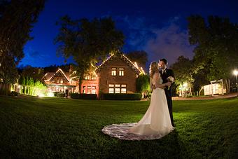 Exterior: Couple on Front Lawn - Briarhurst Manor in Manitou Springs, CO Restaurants/Food & Dining