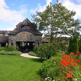 Exterior: Restaurant entrance and gardens - Chateau Morrisette Winery and Restaurant in Floyd, VA American Restaurants