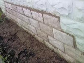 Exterior: finished garage wall repair - Eddie's Masonry in Port Byron, NY Masonry & Bricklaying Contractors