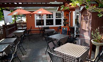 Exterior: Outside dining offered year round on covered patio - Girardi's Osteria in Edmonds, WA Italian Restaurants