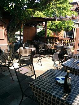 Exterior: Patio dining available year round in covered area - Girardi's Osteria in Edmonds, WA Italian Restaurants