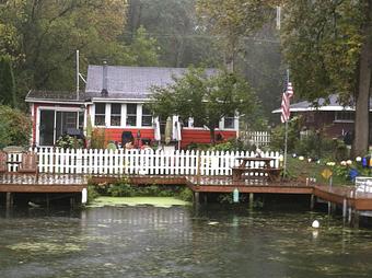 Exterior: Quirky cottages line the banks of the Cayuga Seneca Canal.  This one is my favorite. - Mid-Lakes Navigation Company in Skaneateles, NY Business Services
