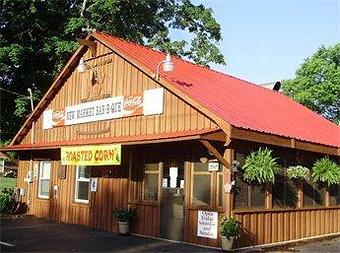 Exterior: Isn't it cute!! Established in 1995 by Darrel and Virginia Day - Purchased by Kelly & Libby Webb in June of 2008. - New Market BBQ in Downtown New Market, AL - New Market, AL Barbecue Restaurants