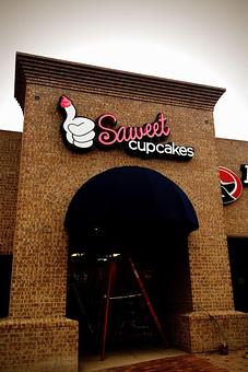 Exterior: Check out our sign - Saweet Cupcakes in San Antonio, TX Dessert Restaurants