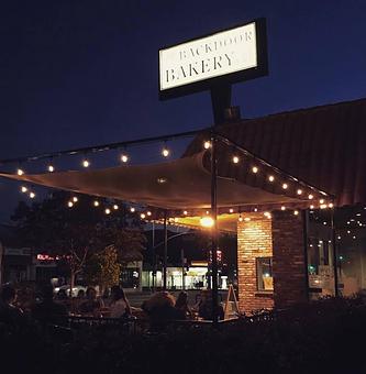 Exterior: Our side patio being enjoyed at night! - The Back Door Bakery & Cafe in Sunland, CA American Restaurants