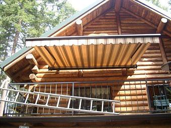 Exterior: Retractable awning mounted to a home. Available in almost any size or color By Tim Hubbard Construction of Southern Oregon - Tim Hubbard Construction in Wilderville, OR Builders & Contractors