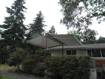 Exterior: Retractable awnings doubled up to make instant shade on a hot summer day By Tim Hubbard Construction of Southern Oregon - Tim Hubbard Construction in Wilderville, OR Builders & Contractors