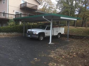 Exterior: Freestanding all steel two car carport By Tim Hubbard Construction of Southern Oregon - Tim Hubbard Construction in Wilderville, OR Builders & Contractors