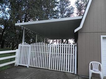 Exterior: Aluminum carport attached to side of garage By Tim Hubbard Construction of Southern Oregon - Tim Hubbard Construction in Wilderville, OR Builders & Contractors