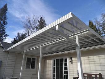 Exterior: Clear Lexan panel patio cover By Tim Hubbard Construction of Southern Oregon - Tim Hubbard Construction in Wilderville, OR Builders & Contractors