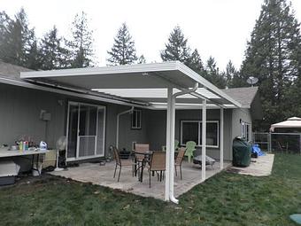 Exterior: Factory painted patio cover with polycarbonate skylights By Tim Hubbard Construction of Southern Oregon - Tim Hubbard Construction in Wilderville, OR Builders & Contractors