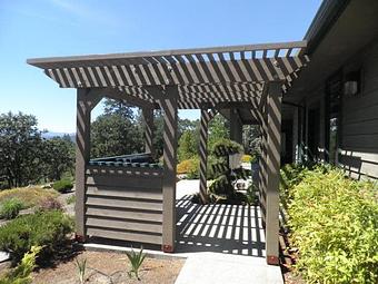 Exterior: Stained cedar wood pergola By Tim Hubbard Construction of Southern Oregon - Tim Hubbard Construction in Wilderville, OR Builders & Contractors