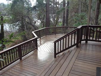 Exterior: Composite deck with cedar railing By Tim Hubbard Construction of Southern Oregon - Tim Hubbard Construction in Wilderville, OR Builders & Contractors