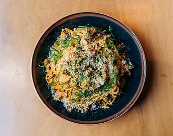 Product: this tossed noodle mazemen features a korean take on a classic italian cream sauce. temomi noodles tossed in a gochujang cream sauce with parmesan cheese, mushrooms, Bub City's smoked pork shoulder and finished with sesame seeds and shredded nori - Ramen San in Chicago, IL Japanese Restaurants