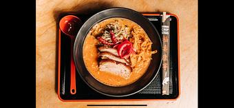 Product: a citrusy pork broth and tokyo wavy noodles with slow roasted pork belly, fresh cabbage & herb salad and crispy tortilla strips - Ramen San in Chicago, IL Restaurants/Food & Dining