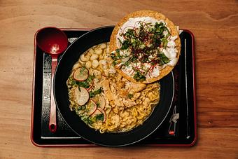 Product: our version of the traditional Mexican dish. our classic chicken broth with a salsa verde topped with poached chicken, white hominy, cabbage mix and a creamy tostada. - Ramen San in Chicago, IL Japanese Restaurants