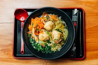 Product: from our collaboration with Manny's Deli, this special ramen features our chicken broth, Tokyo wavy noodles, Manny's matzo balls, carrot, pickled celery, dill, scallions and chicken cracklins - RAMEN-SAN Whisky Bar in Fulton Market - Chicago, IL Japanese Restaurants