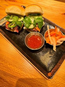 Product: two umamicue banh mi sliders, with a side of pickled veg and side of umamicue bbq sauce - RAMEN-SAN Whisky Bar in Fulton Market - Chicago, IL Japanese Restaurants