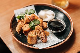 Product: fried Filipino pork spring roll bites with truffle soy vinegar and pickled daikon - RAMEN-SAN Whisky Bar in Fulton Market - Chicago, IL Japanese Restaurants