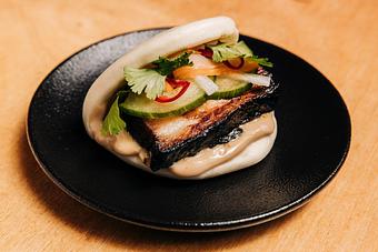 Product: limited edition: a play on the traditional vietnamese sandwich, chashu pork, served with pickled daikon and carrot, cucumber, jalapeño and cilantro on a steamed bun - RAMEN-SAN Whisky Bar in Fulton Market - Chicago, IL Japanese Restaurants