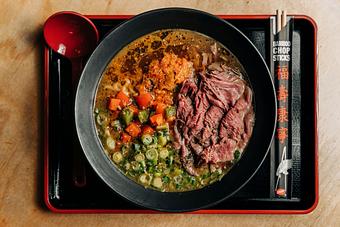 Product: our take on a chicago classic, featuring classic chicken broth and italian beef miso, served with tokyo wavy noodles, slow cooked italian beef, caruso provisions giardiniera kimchi, roasted sweet peppers, giardiniera oil and oregano - RAMEN-SAN Whisky Bar in Fulton Market - Chicago, IL Japanese Restaurants