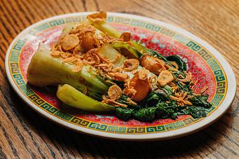 Product: blanched baby bok choy topped with oyster sauce and crispy shallots - RAMEN-SAN Whisky Bar in Fulton Market - Chicago, IL Japanese Restaurants