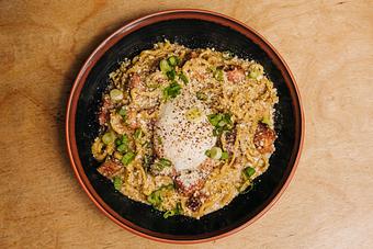 Product: this tossed noodle mazemen is a twist on a classic Roman pasta featuring temomi noodles in a creamy mix of miso, egg yolk and pecorino cheese with guanciale, black pepper and scallions. - RAMEN-SAN Whisky Bar in Fulton Market - Chicago, IL Japanese Restaurants