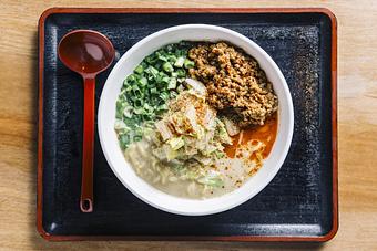 Product: a crowd favorite, and one of our OG bowls: our classic chicken broth with white miso, served with tokyo wavy noodles, spicy ground pork, blanched napa cabbage, and scallions, finished with szechuan peppercorn and ichimi - RAMEN-SAN Whisky Bar in Fulton Market - Chicago, IL Japanese Restaurants