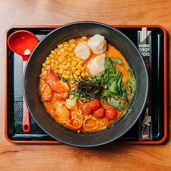 Product: this unctuous ramen features a savory garlic lobster broth topped with crab dumplings, lobster meat, buttered corn, basil mix, roasted scallion and chili threads finished with a touch of spicy lobster oil. - RAMEN-SAN Whisky Bar in Fulton Market - Chicago, IL Japanese Restaurants