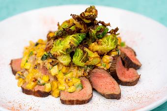 Product: ANCHO CHILE SOUS VIDE BUTCHER STEAK, CREAMED CORN, DOUBLE FRIED POTATOES AND FRIED BRUSSELS SPROUTS. - Red Mesa Cantina in Downtown St Petersburg - St Petersburg, FL Mexican Restaurants