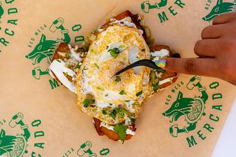 Product: Fried egg, queso fresco, cilantro-onion, crema, salsa verde frita. - Red Mesa Mercado in St. Petersburg, FL Mexican Restaurants