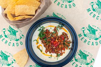 Product: House queso, chorizo, pico, chile árbol oil. Served with chips. - Red Mesa Mercado in St. Petersburg, FL Mexican Restaurants