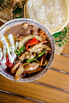 Product: Rice, refried beans, peppers, onions, lettuce, tomato, crema, cheddar jack cheese. Served with 3 flour tortillas. (Pictured with Chicken) - Red Mesa Mercado in St. Petersburg, FL Mexican Restaurants