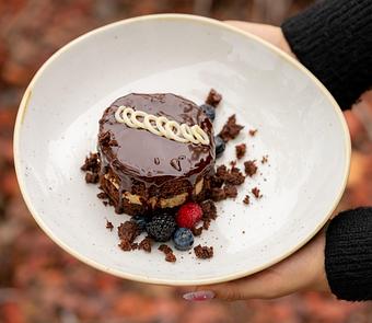 Product: CHOCOLATE CAKE, VANILLA PASTRY CREAM, CHOCOLATE GANACHE, CHOCOLATE CRUMBLE AND MACERATED BERRIES. - Red Mesa Restaurant in St Petersburg, FL Mexican Restaurants
