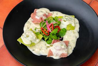 Product: BLUE CRAB AND SOFRITO STUFFED RAVIOLIS WITH ROASTED JALAPENO FETA CHEESE SAUCE AND WATERCRESS SALAD WITH DIJON VINAIGRETTE. - Red Mesa Restaurant in St Petersburg, FL Mexican Restaurants