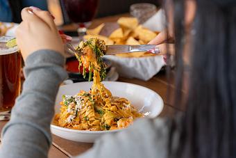 Product: House-made fettuccine pasta, sauteéd bay shrimp, watercress, garlic, cotija cheese and ancho chile bechamel sauce. - Red Mesa Restaurant in St Petersburg, FL Mexican Restaurants