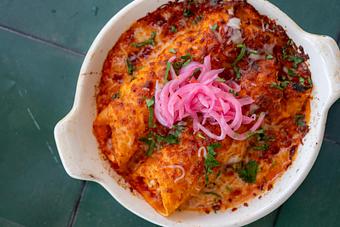 Product: Potato and egg enchiladas, red onions, queso fresco, tomato motuleña sauce. - Red Mesa Restaurant in St Petersburg, FL Mexican Restaurants