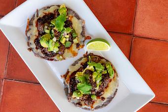 Product: Blue corn tortillas, Oaxaca cheese, avocado, tomatillo salsa, salsa macha. - Red Mesa Restaurant in St Petersburg, FL Mexican Restaurants