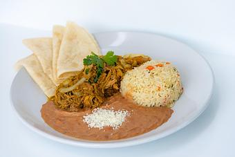 Product: Roast pork, poblano peppers, onions, chile verde sauce, refried beans and cilantro rice. Tortillas on request. - Red Mesa Restaurant in St Petersburg, FL Mexican Restaurants