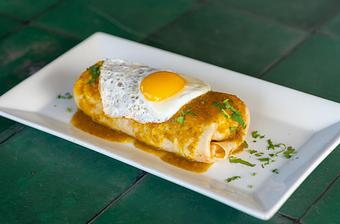 Product: Fried egg, New Mexican green chile, cheese, potatoes, peppers, onions, chile verde, queso fresco, cilantro. - Red Mesa Restaurant in St Petersburg, FL Mexican Restaurants