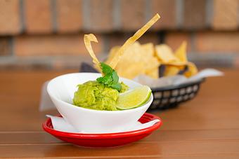 Product: Avocado, onion, jalapeño, cilantro, lime. Chips. - Red Mesa Restaurant in St Petersburg, FL Mexican Restaurants