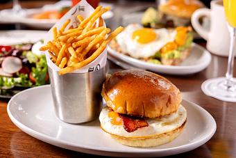 Product: Bacon, Egg & Cheese with an organic egg, NY cheddar, smoked chili aioli and thick cut bacon on a brioche bun. - Roxy Bar in TriBeCa - New York, NY Bars & Grills